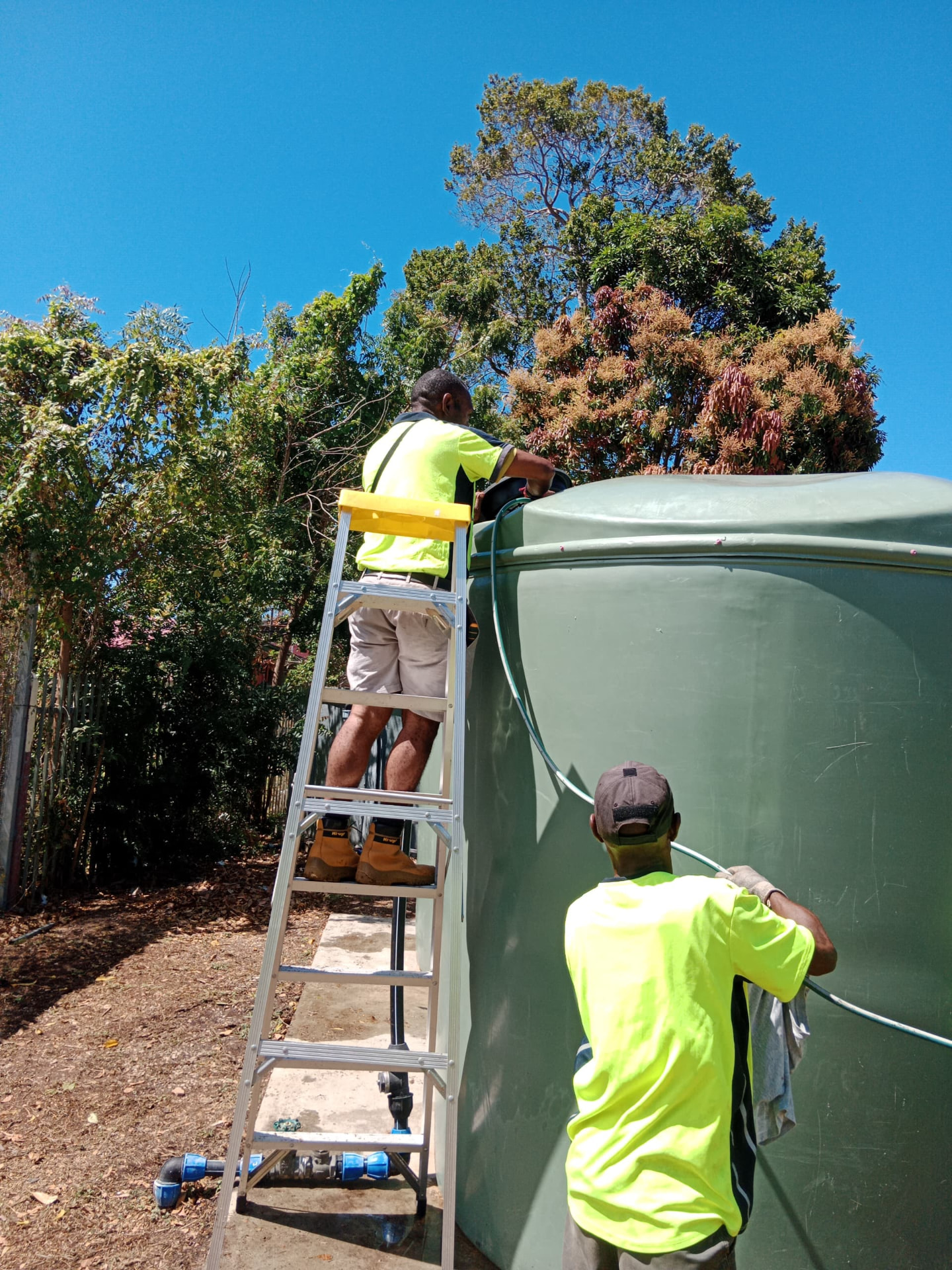 Crew cleaning a commercial water tank
